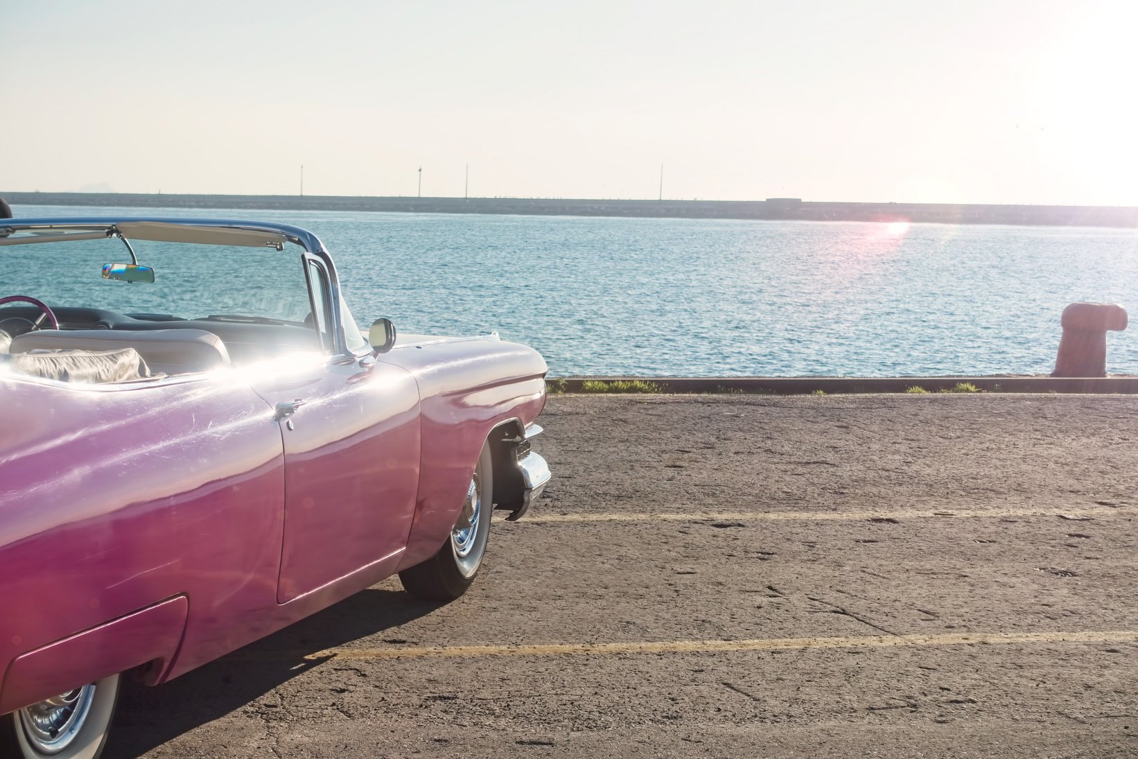 Vintage Pink Car near the sea.